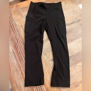 Black Lululemon pants with pockets. Cropped.
